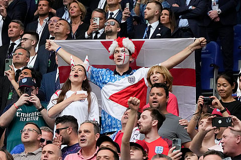 Fans cheer during England and Slovakia match